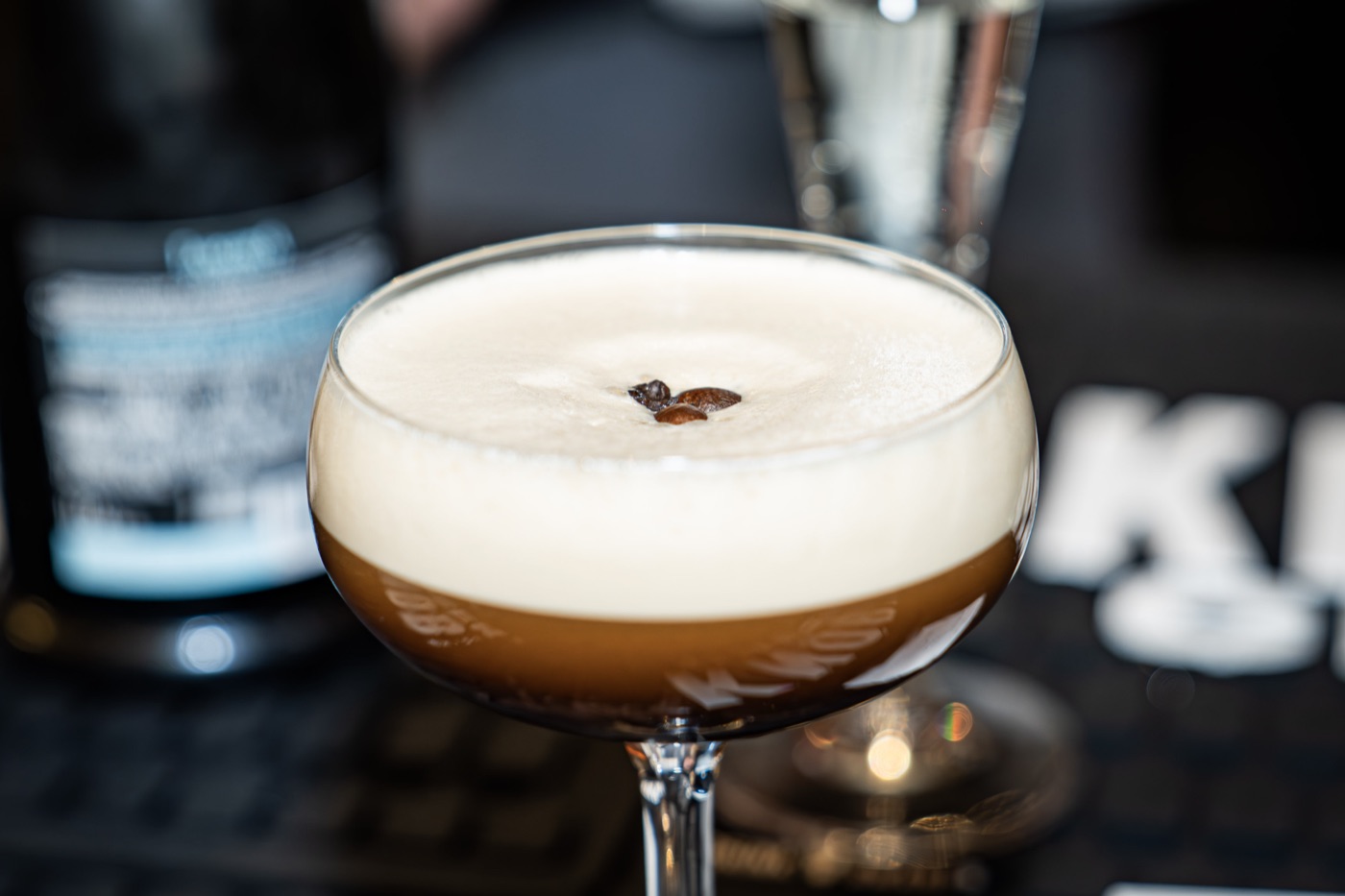 Espresso martini at Little Alley Steak Alpharetta, served coupe-up with a thick crema head and three coffee beans